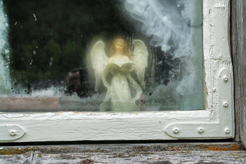 Small angel figure in the window at Inderdalen Farm watching over the farm.