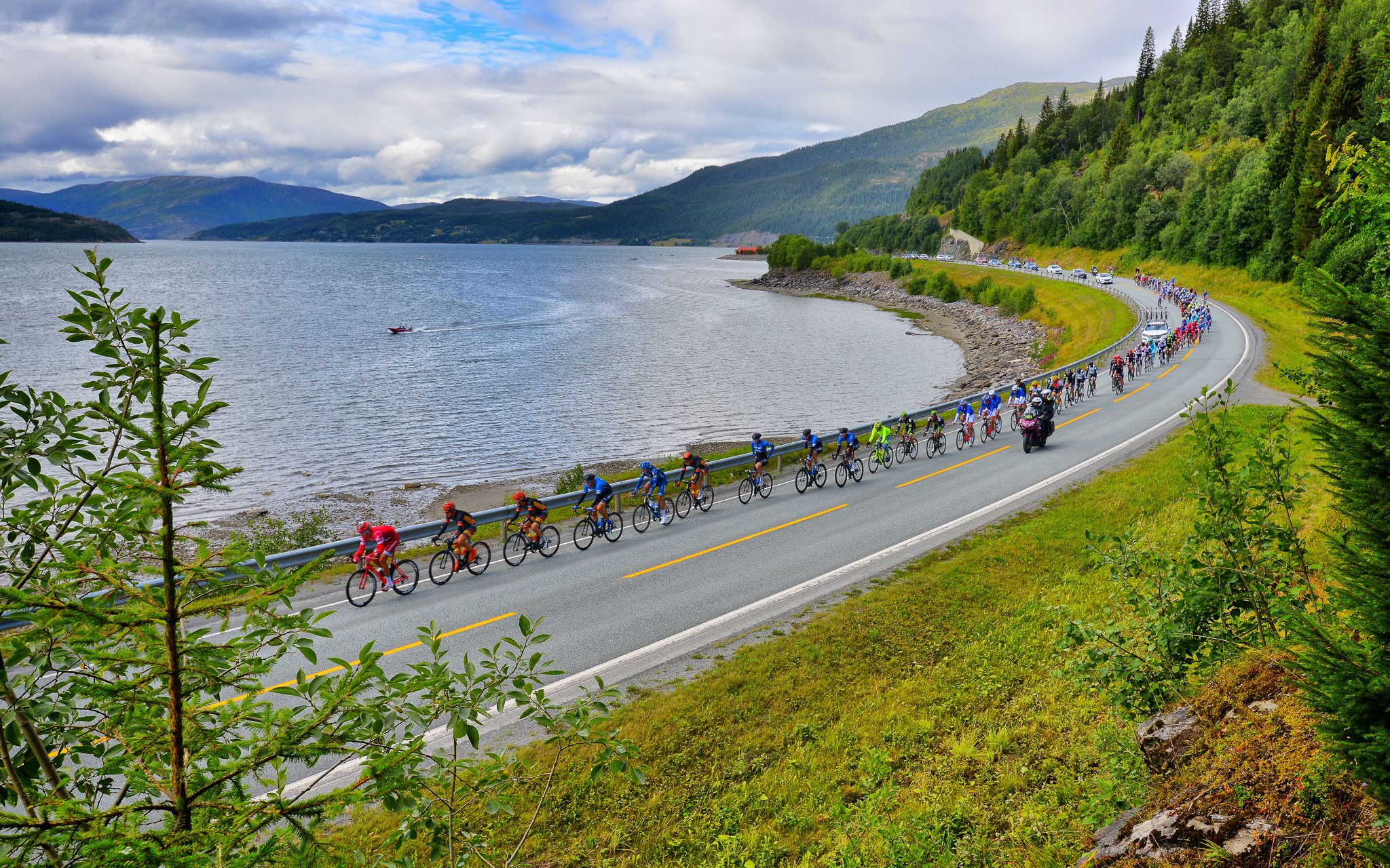 Bikers by a fjord