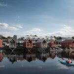 Wooden beachhouses on the fjord in the senter of the small town Hemnesberget