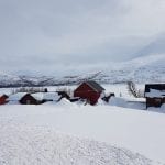 Stekvasselv Farm covered in snow in all white surroundings, during the winter.