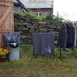 Home-made clothes and crafts from “Kråkeslottet” on an exhibition outside at a farm.