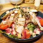 A colorful and delicious homemade and fresh salad with chicken at Lille Havfruen Kafé.