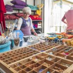 Anne-Lise, the owner of Kråkeslottet, making crafts in her workshop with lots of different materials available.