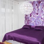 One of the colorful and artistic bedrooms at Mileperlen Gallerihotell with the artist and owner’s own paintings.