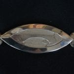 One part of the silver ceremonial chain of office for the Mayor. This one with Sjøforsbrua, a bridge passing a waterfall.