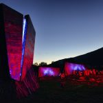 Klemetspelet’s outdoor stage with its awarded architecture, at night with the stage in the mysterious red-violet colors.
