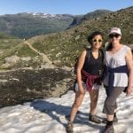 Mom and daughter hiking in the mountain up to the cabin, Rabothytta, and meeting snow on this warm summer day.