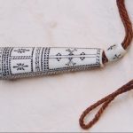 Sami ornament made of bones with nice decorations.