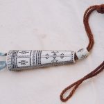 Sami ornament made of bones with nice decorations.