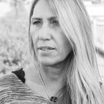 Black-and-white portrait of a concentrated Hilde Sletten, perhaps thinking of all the graphic designs she must work on.