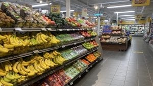 A colorful and full fruit section at one of the local stores, Coop Korgen, with an overview of other sections further in.