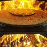 The local bread kamkaka baking on an open fire.