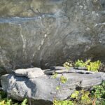 A small rock in front of a big rock